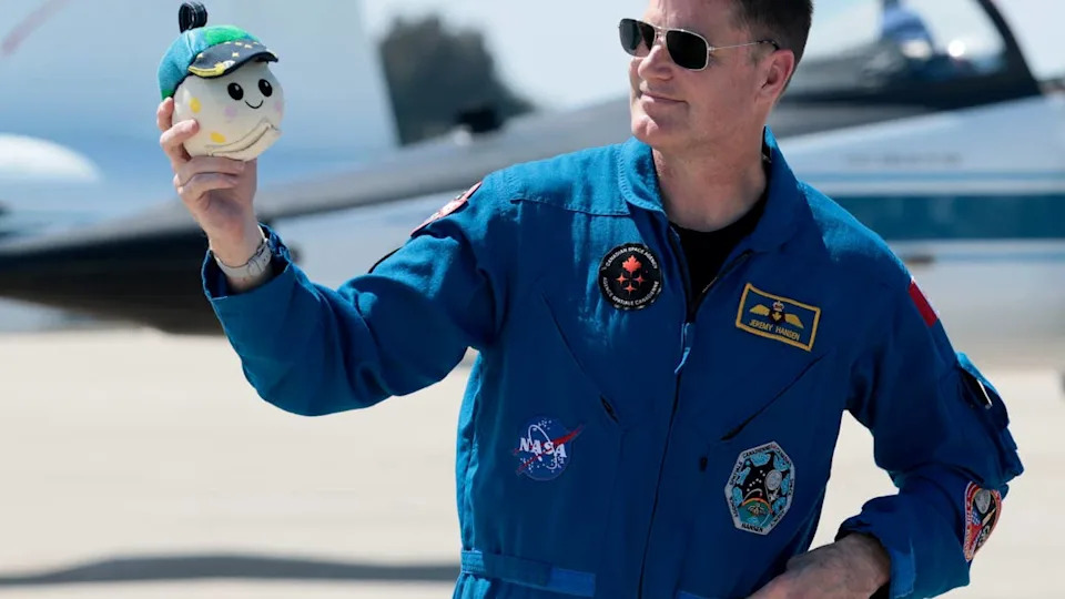 Artemis II crew mission specialist Jeremy Hansen of CSA (Canadian Space Agency) holds a plush toy of the "moon mascot" after arriving at the Kennedy Space Center on March 27, 2026 in Cape Canaveral, Florida. The astronauts arrived to begin preparations for an April 1, 2026 launch for a 10-day mission, which will take them around the Moon and back to Earth. <p>&lpar;Photo by Joe Raedle&sol;Getty Images&rpar;</p>
