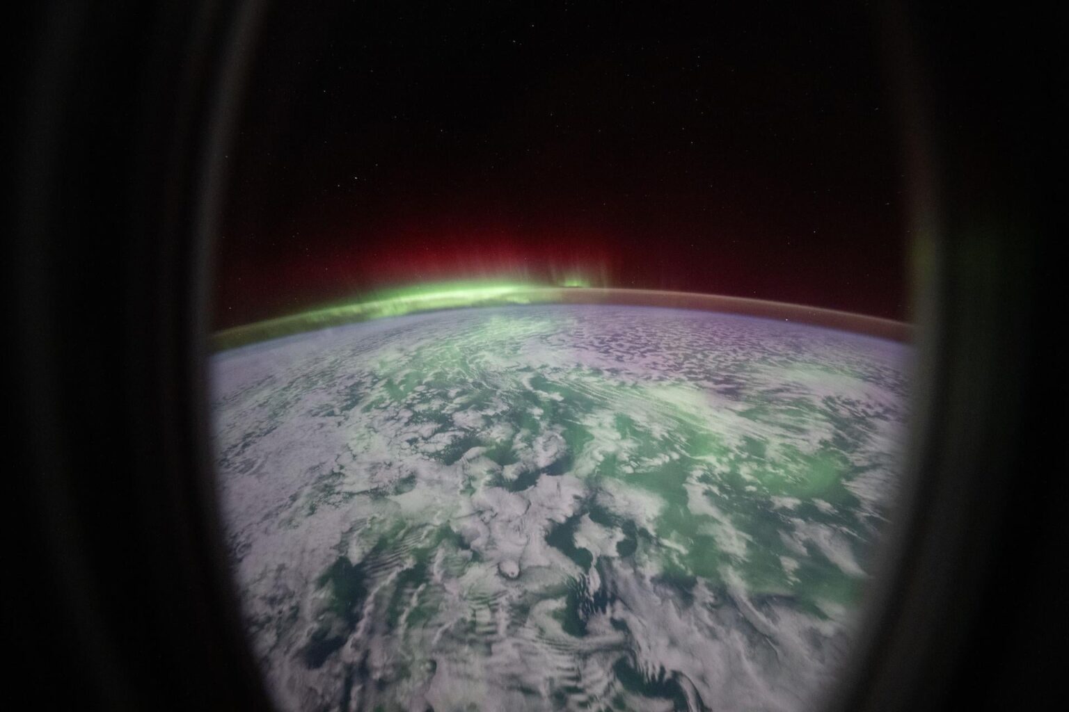 The aurora australis glows above the Indian Ocean