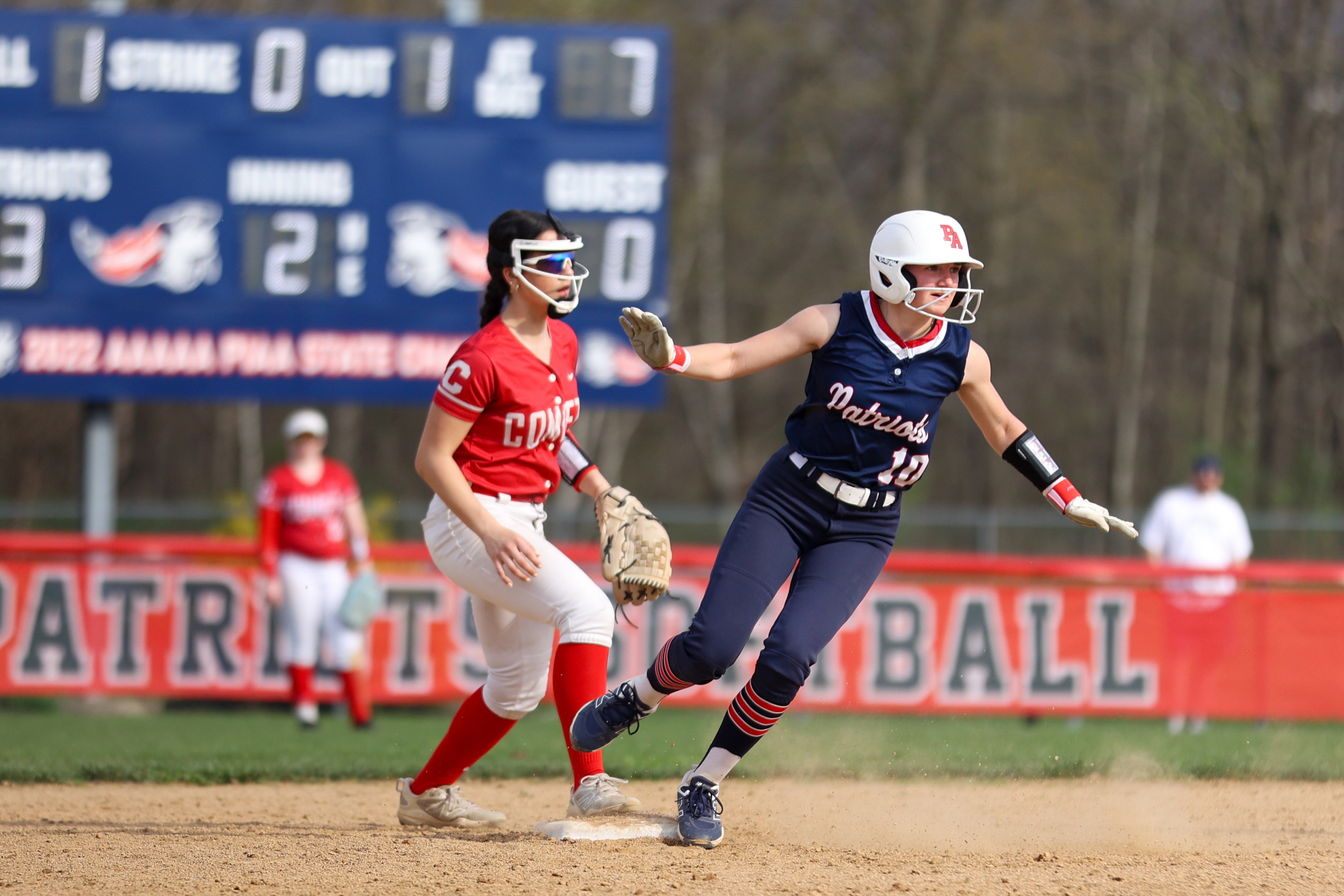Pittston Area’s Kelcey Podwika (10) rounds second base during a...