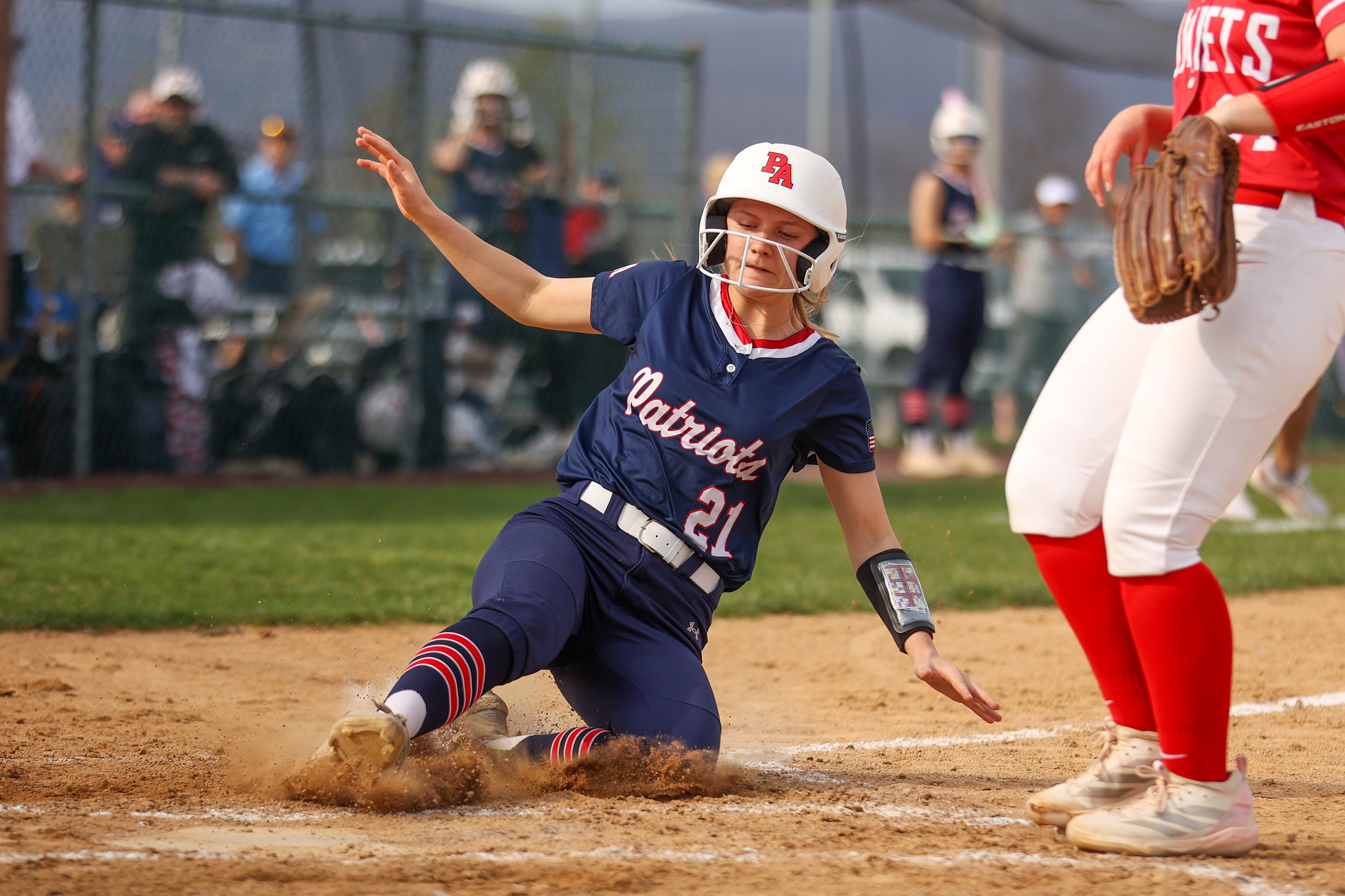 Pittston Area’s Isabella Kroski slides into home during a softball...