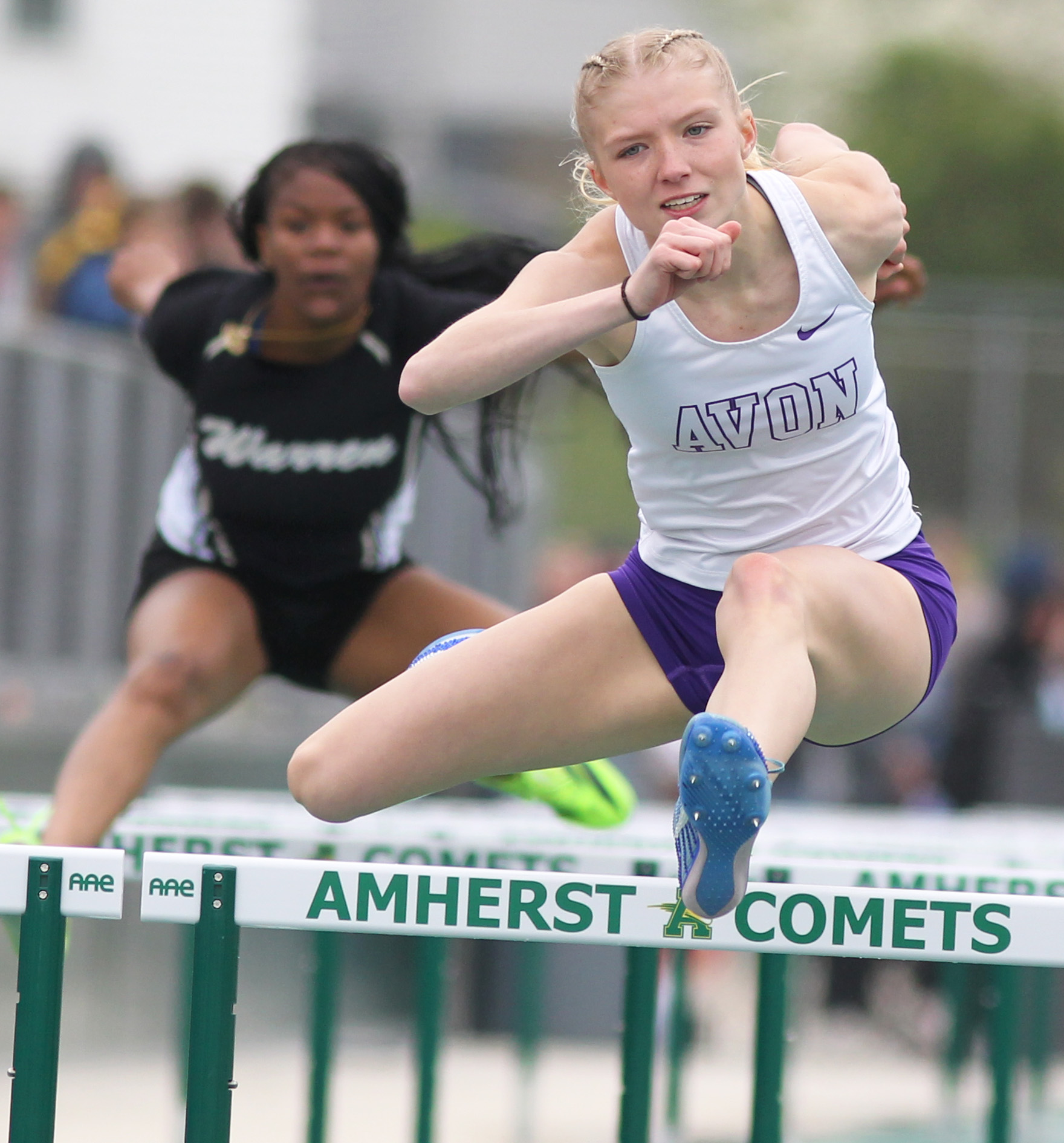 Avon's Paige Justice competes in the 100 meter hurdles at...