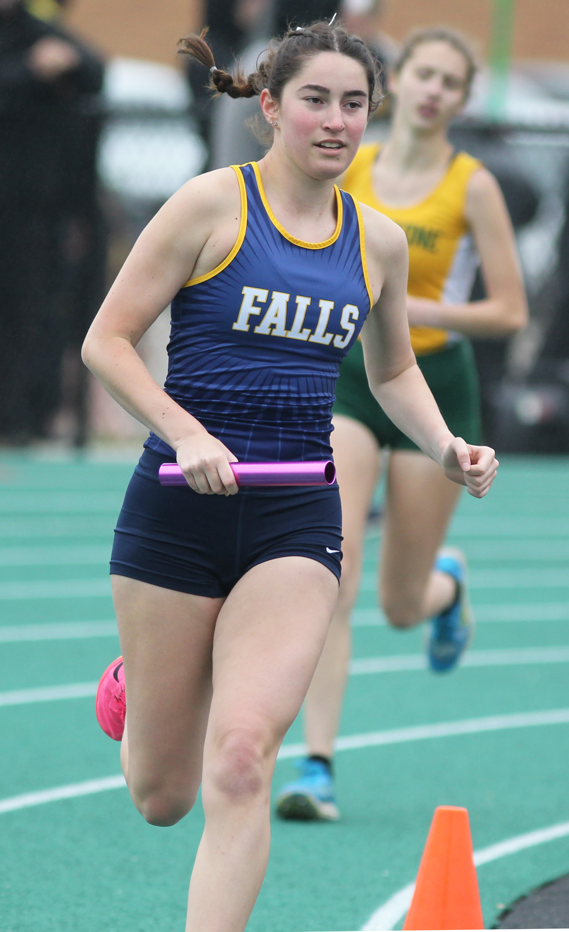 Runners compete in the 4x800 meter relay at the Comet...