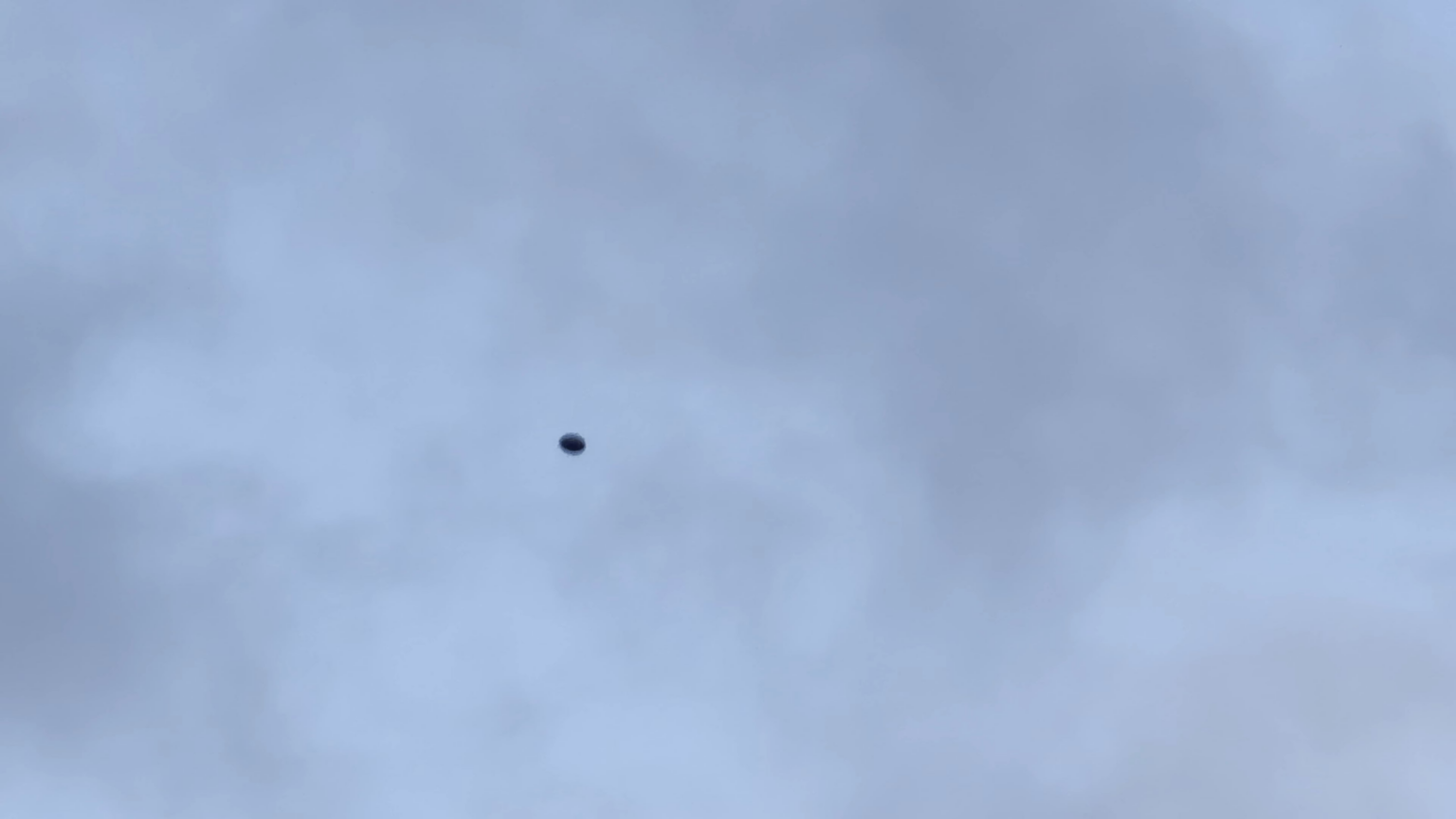 UFO seems to be rotating and wobbling at the same time UFO seems to be rotating and wobbling at the same time