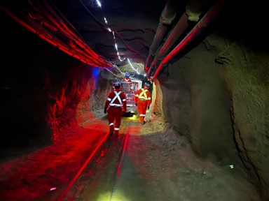 SNOLAB staff escort the SuperCDMS dilution fridge nearly a mile hrough the mine drift to the lab entrance.