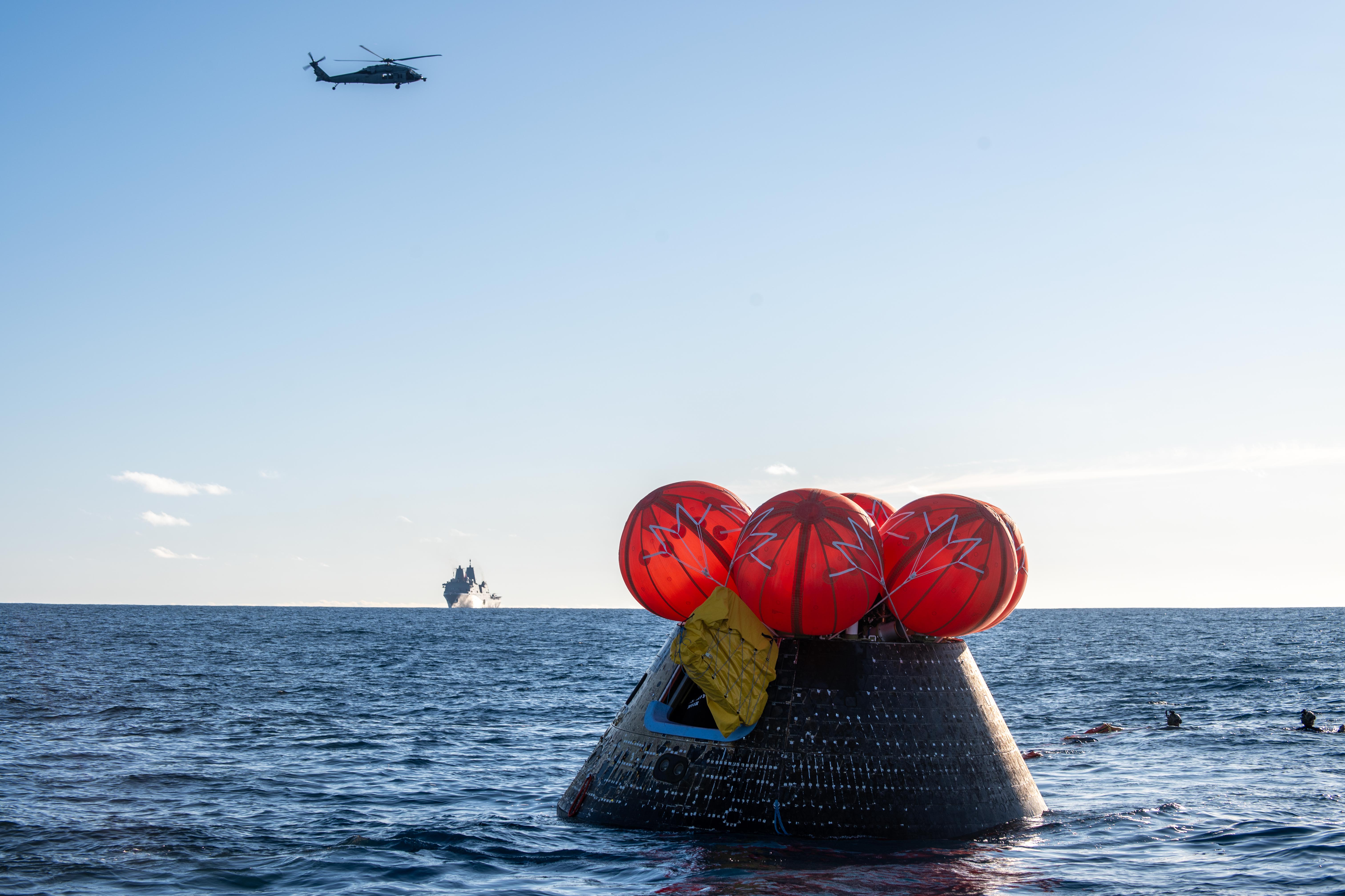 NASA's Orion spacecraft carrying Artemis II astronauts Reid Wiseman, Victor...