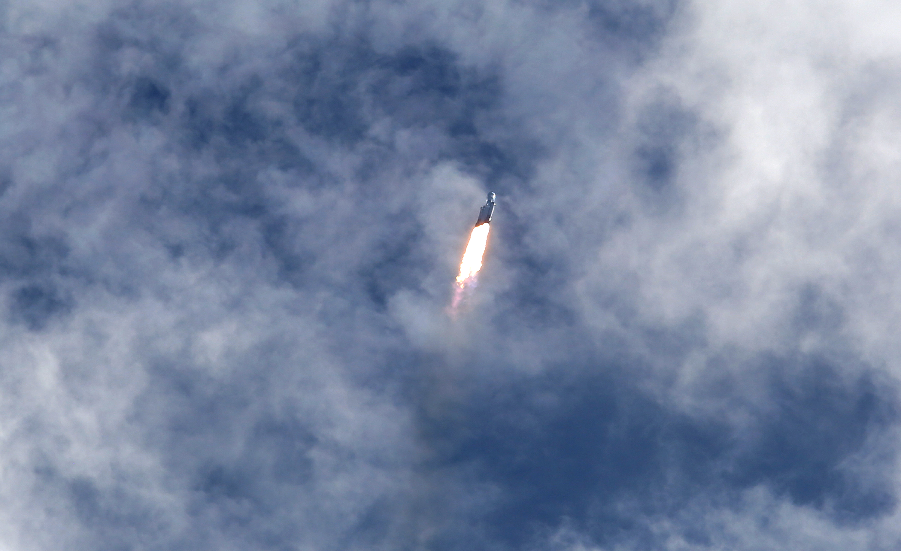 A SpaceX Falcon Heavy rocket launches from Kennedy Space Center's...