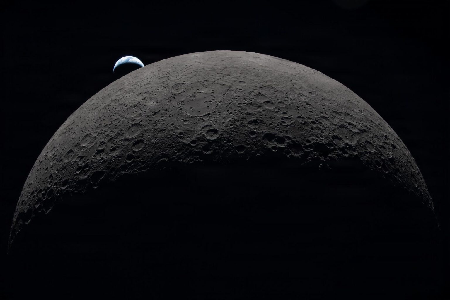 Earth sets at 6:41 p.m. EDT, April 6, 2026, over the Moon’s curved limb in this photo captured by the Artemis II crew during their journey around the far side of the Moon.