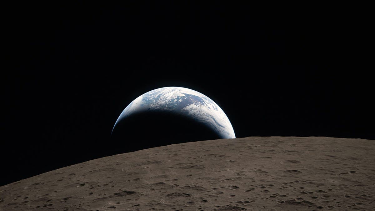 Earthset seen through Orion spacecraft window during Artemis II mission flyby of the Moon.
