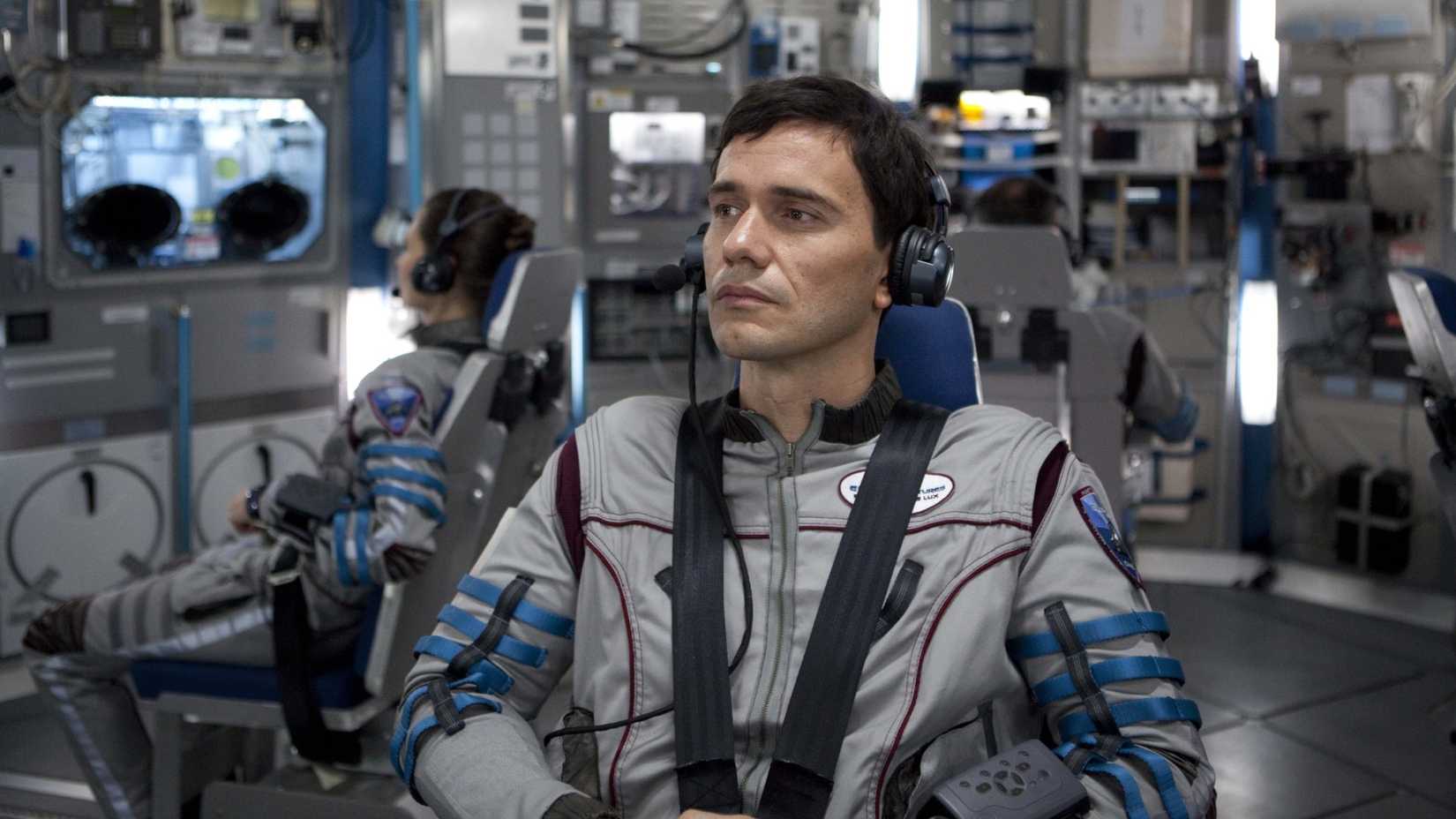 An astronaut looks on in Europa Report