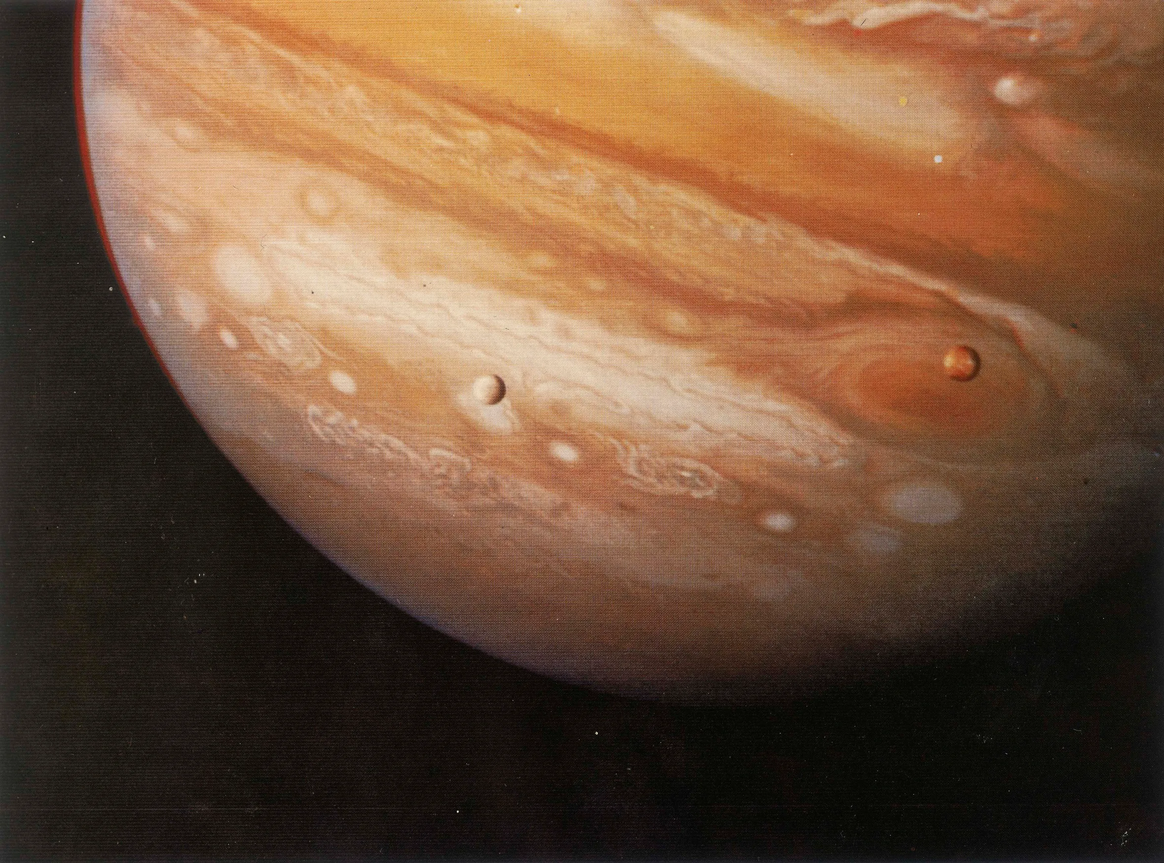 Jupiter with the Great Red Spot and moons Io and Europa.