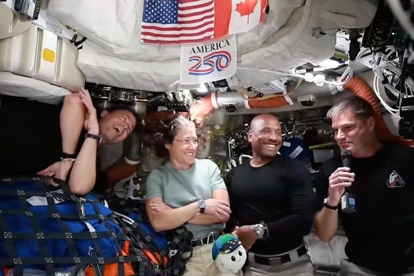 This image from video provided by NASA shows the Artemis II crew, from left, Commander Reid Wiseman, mission specialist Christina Koch, pilot Victor Glover and Canadian astronaut and mission specialist Jeremy Hansen as they answer media questions during a video conference Wednesday, April 8, 2026
