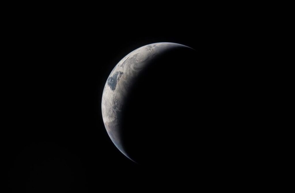 Planet Earth. Imaged from over 230,000 miles away by the crew of Artemis II.
