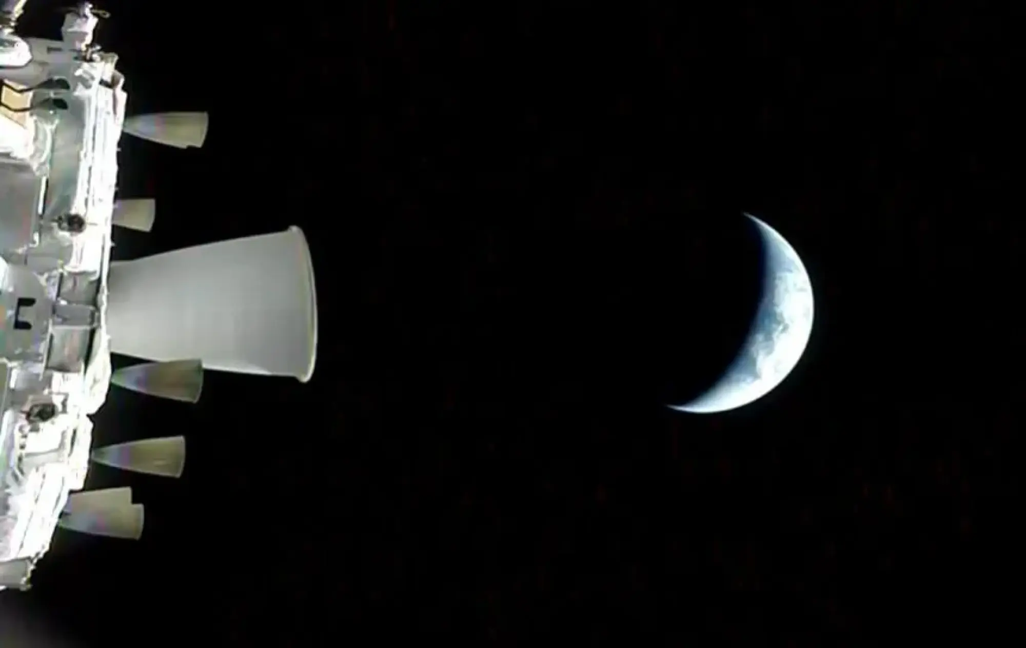 view of the crescent earth from nasa's orion spacecraft from artemis ii mission