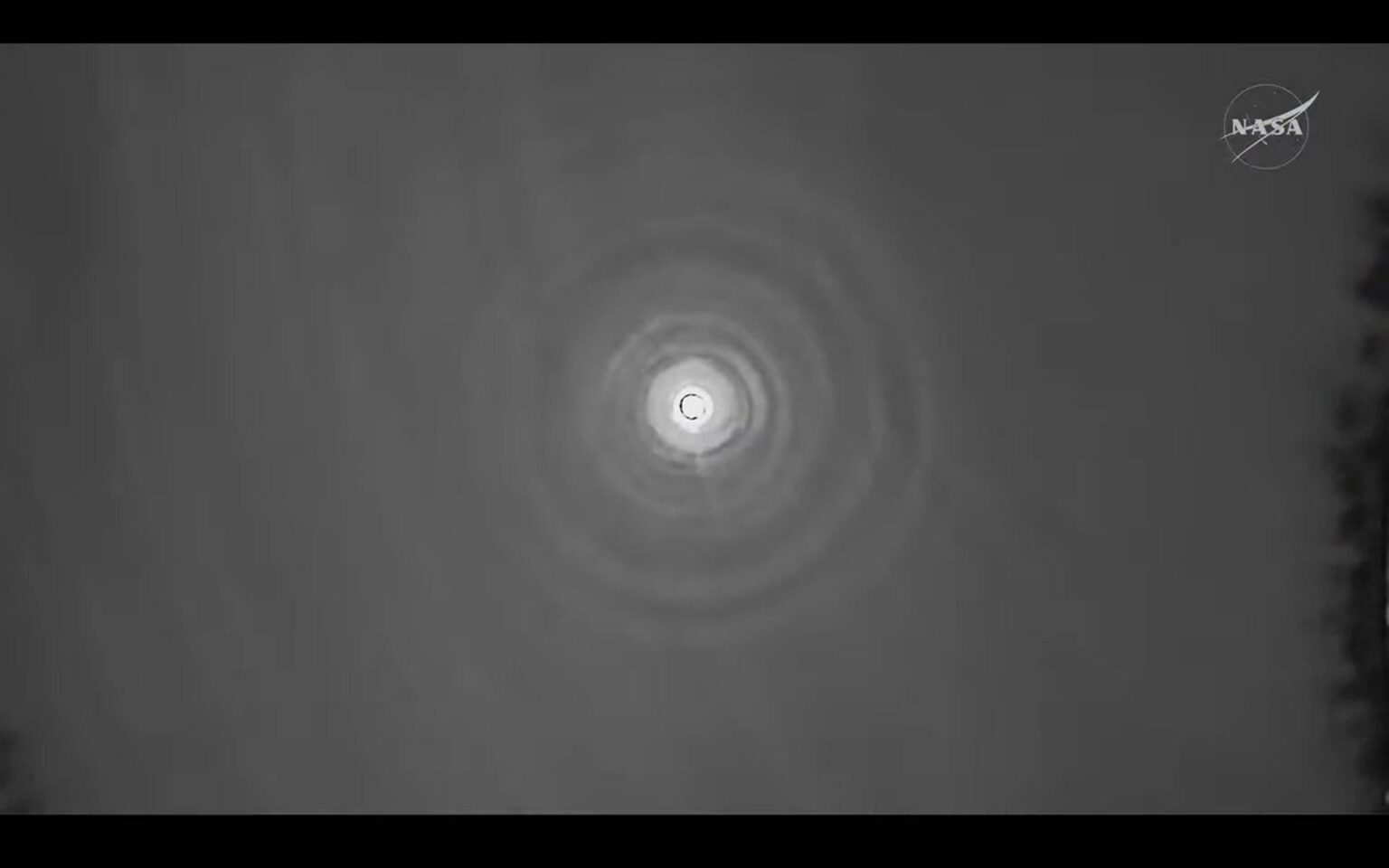 View of Orion Integrity from a recovery plane as Artemis II re-established contact after a 6 minute blackout.