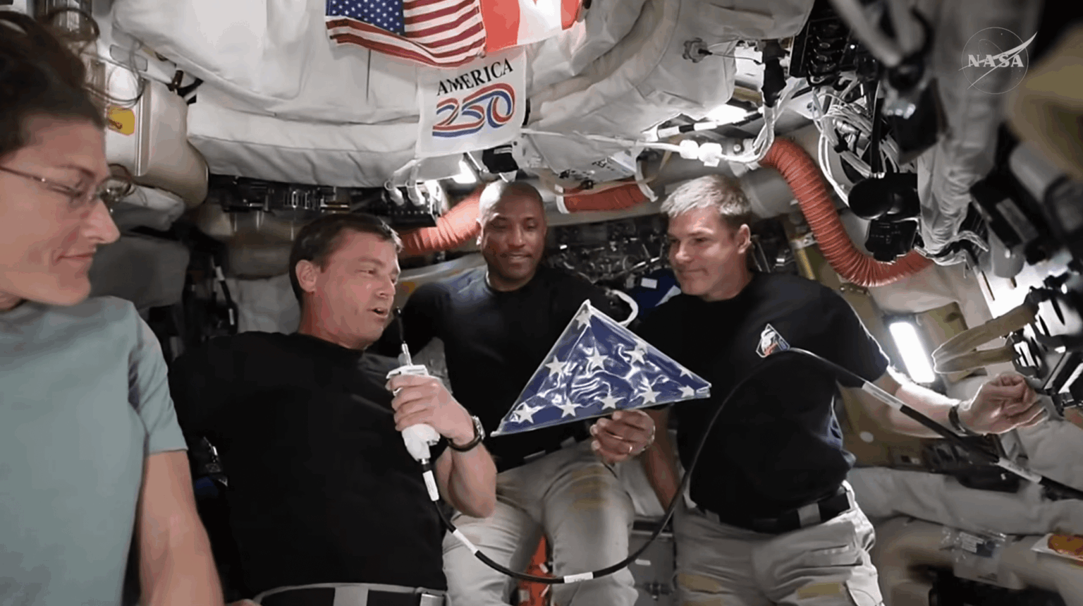 Artemis II brought the never-used flag from the cancelled Apollo 18 mission with them on their journey around the moon (seen during tonight's press event)