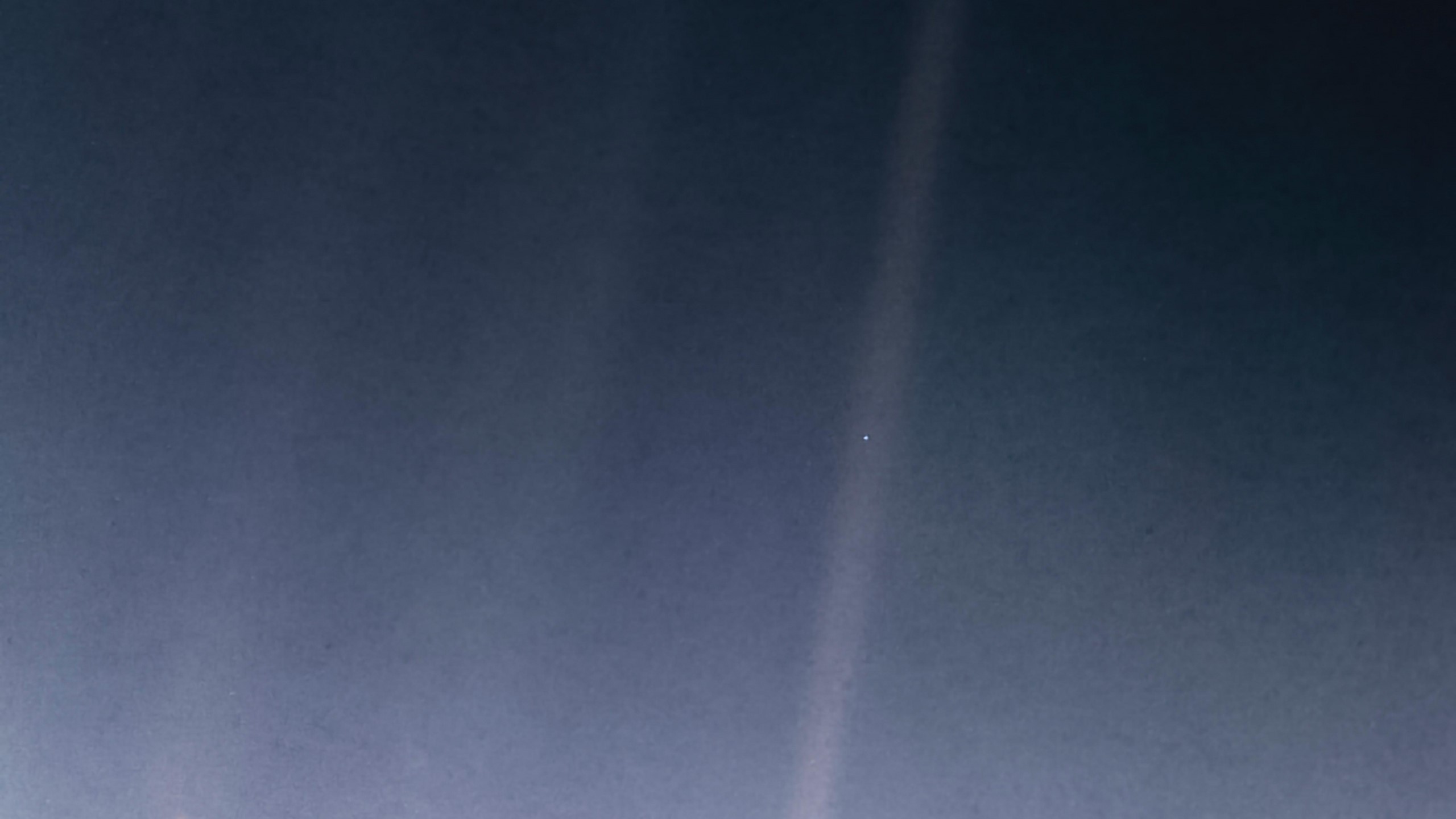 Earth as a "pale blue dot" seen by Voyager 1 in 1990.