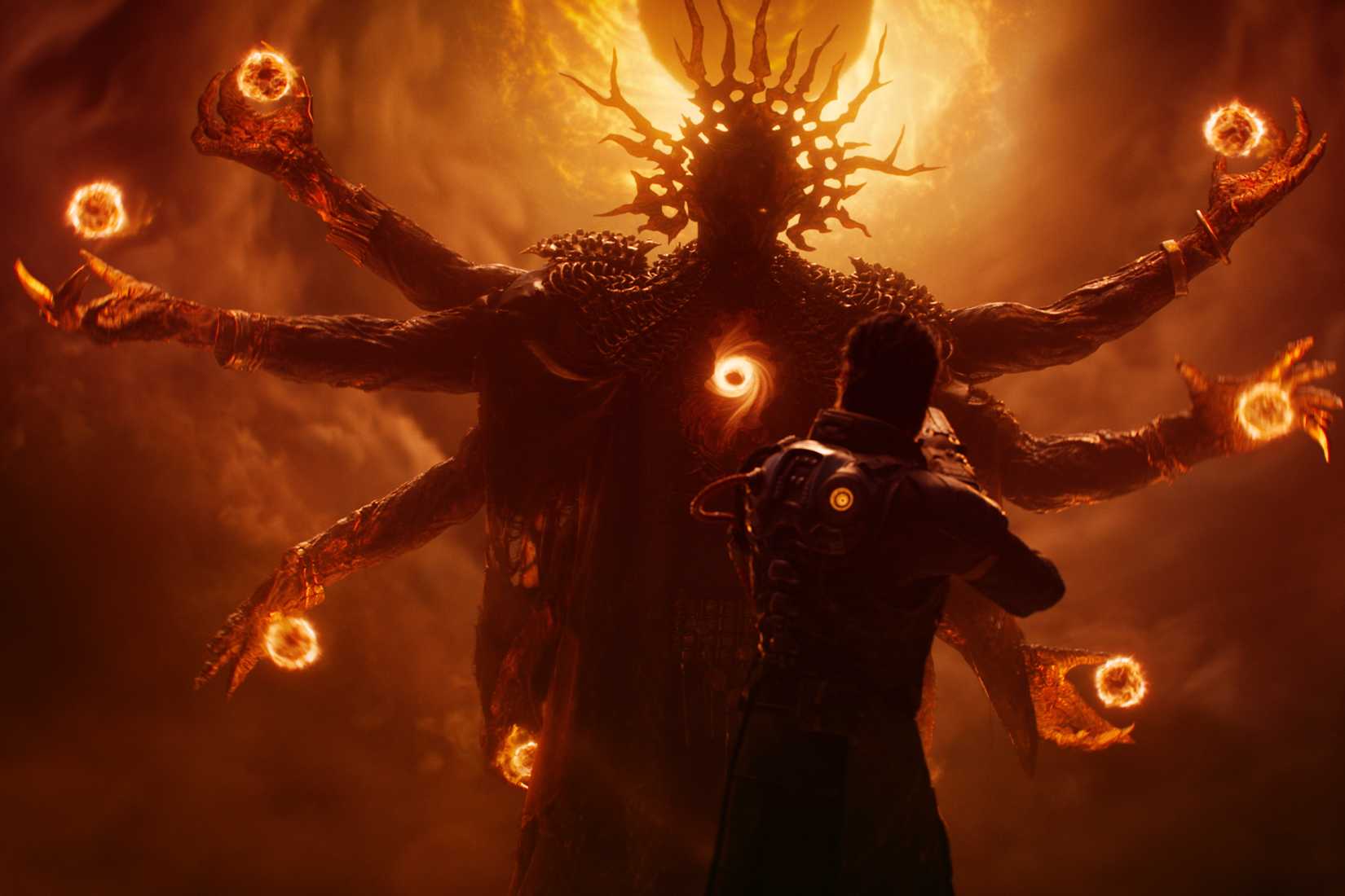 A massive multi-armed alien entity confronts the player character in Saros