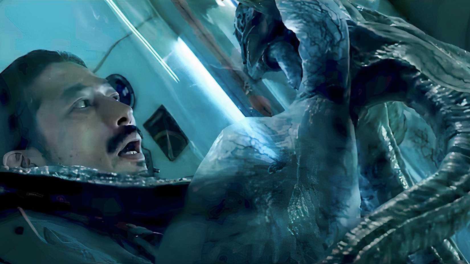 Sho (Hiroyuki Sanada) stares at Calvin through the glass in Life