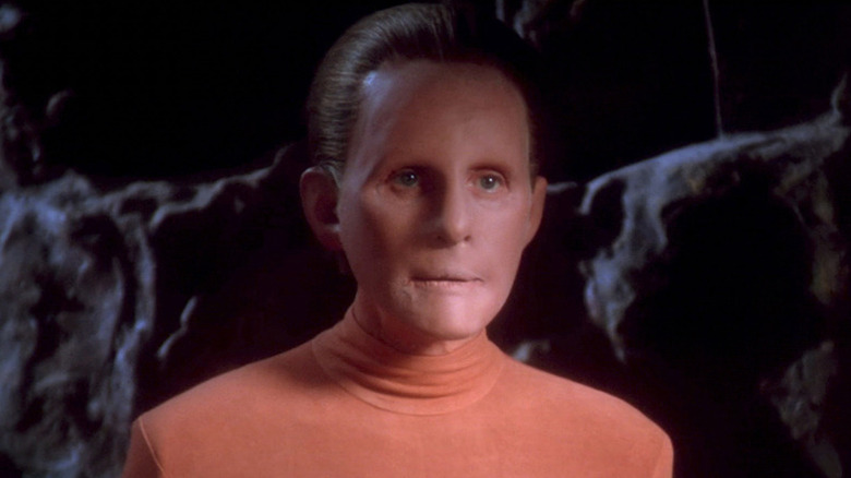 A Changeling (Salome Jens) stands by a rock wall in Star Trek: Deep Space Nine