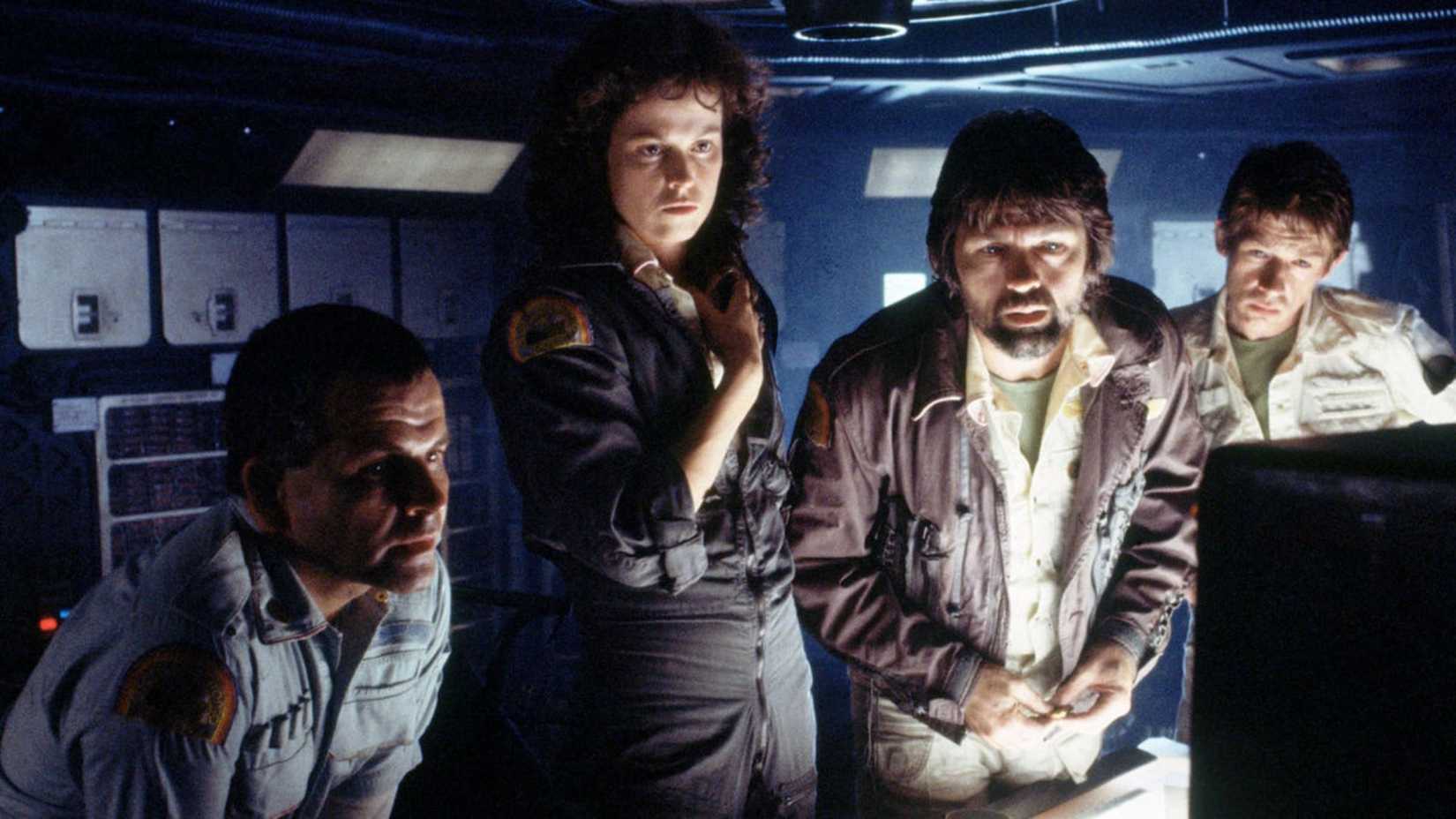 The crew observing a screen on board the Nostromo in Alien (1979)