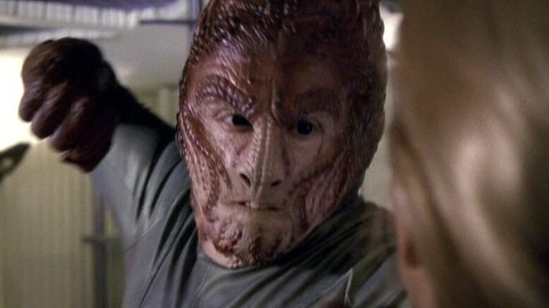A Hirogen Hunter (J. G. Hertzler) prepares to punch in Star Trek: Voyager