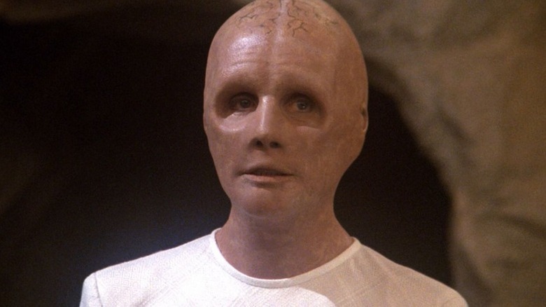 A Progenitor (Salome Jens) stands by a rock wall in Star Trek: The Next Generation