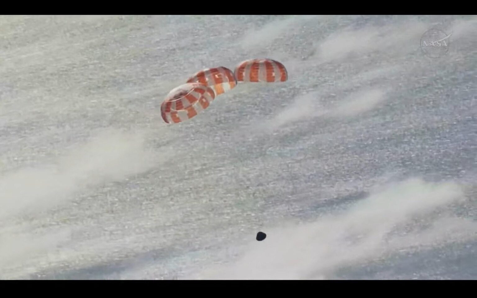 Orion's main parachute has deployed. The spacecraft has a system of 11 chutes that will slow it down from around 300 mph to 20 mph for splashdown.