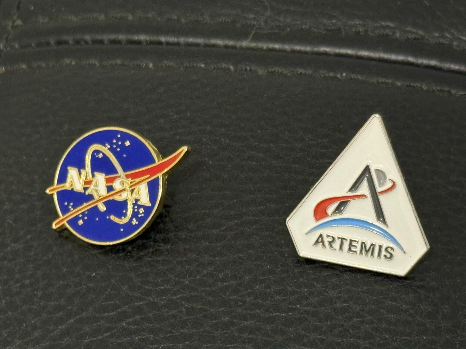 My Artemis II lapel pins I picked up at the International Astronautical Congress (IAC) in Sydney last year