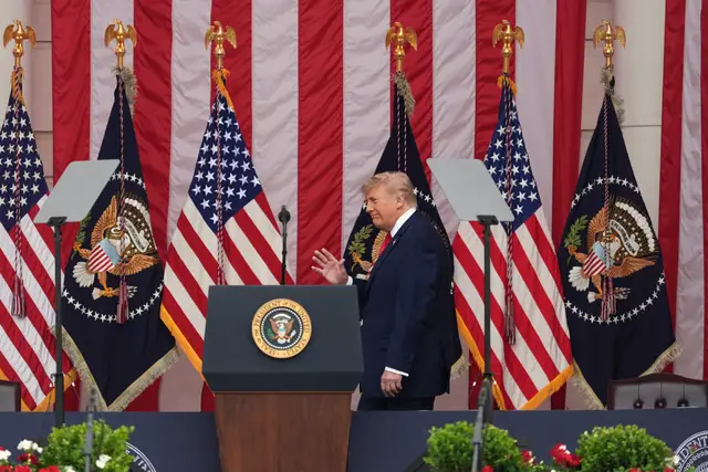 President Donald Trump walks to speak during the 158th National Memorial Day Observance at Arlington National Cemetery