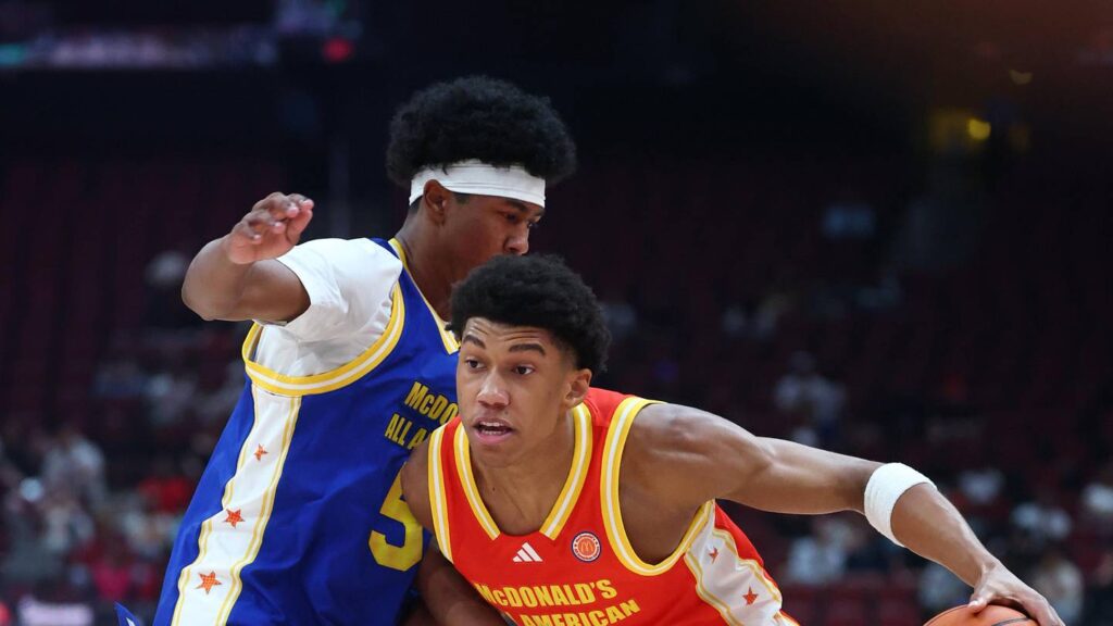 Mar 31, 2026; Glendale, AZ, USA; Bruce Branch III (3) drives to the basket against Jason Crowe Jr (5) during the McDonalds All American Boys Game at Desert Diamond Arena. Mandatory Credit: Mark J. Rebilas-Imagn Images