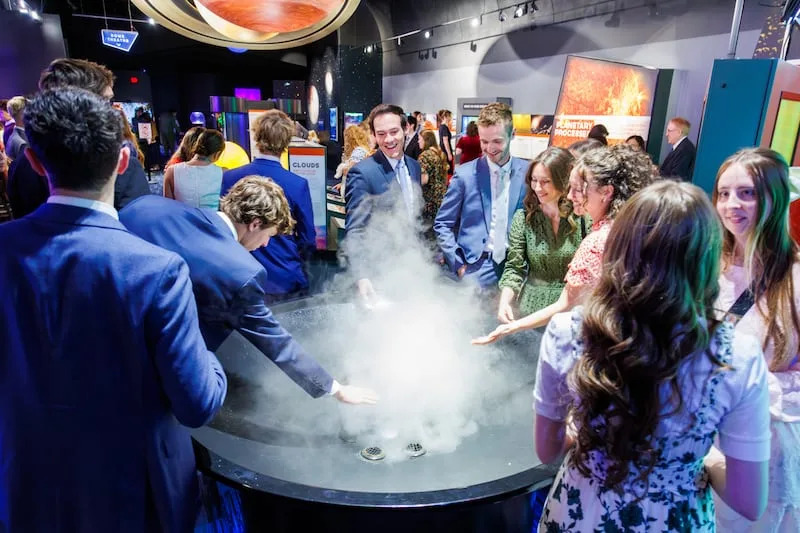 Young adults visit inside the Clark Planetarium in Salt Lake City on April 12, 2026. | The Church of Jesus Christ of Latter-day Saints