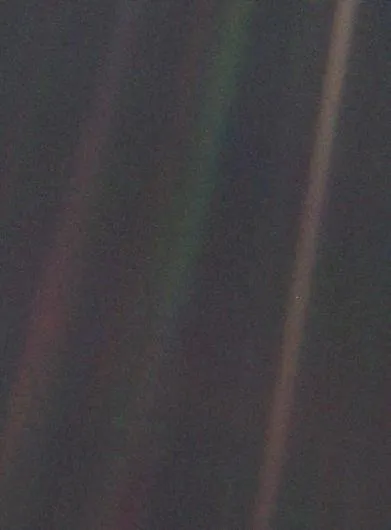 This is the Pale Blue Dot, part of the ‘family portrait’ of the Solar System taken by Voyager 1 looking towards Earth from a distance of 6 billion km. The Earth appears as a tiny speck at the centre of one of the rightmost scattered sunbeams. (Credit: NASA/JPL)