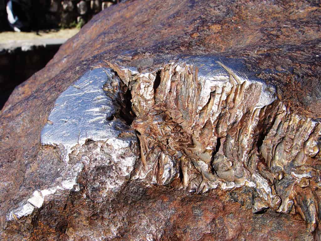 Image showing a shipped section of the meteorite with metallic rock structures showing
