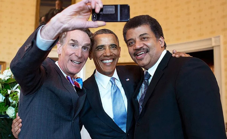 Bill Nye, then-President Barack Obama, and Neil deGrasse Tyson. <a href="https://en.wikipedia.org/wiki/Neil_deGrasse_Tyson#/media/File:Bill_Nye,_Barack_Obama_and_Neil_deGrasse_Tyson_selfie_2014.jpg" rel="nofollow noopener" target="_blank" data-ylk="slk:Photo credit: WhiteHouse/Wikimedia Commons;elm:context_link;itc:0;sec:content-canvas" data-yga="{"yLinkElement":"context_link","yModuleName":"content-canvas","yLinkText":"Photo credit"}" class="link ">Photo credit: WhiteHouse/Wikimedia Commons</a>