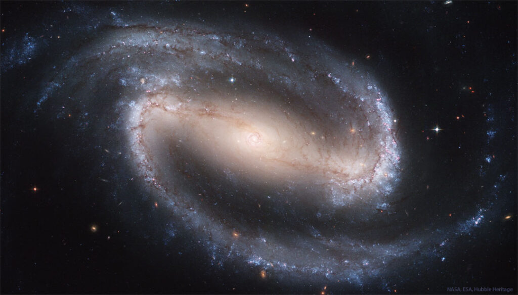 APOD: 2026 May 17 – NGC 1300: Barred Spiral Galaxy The featured image shows a the big beautiful barred spiral
galaxy NGC 1300 with encompassing spiral arms tinted blue from
young stars.
Please see the explanation for more detailed information.