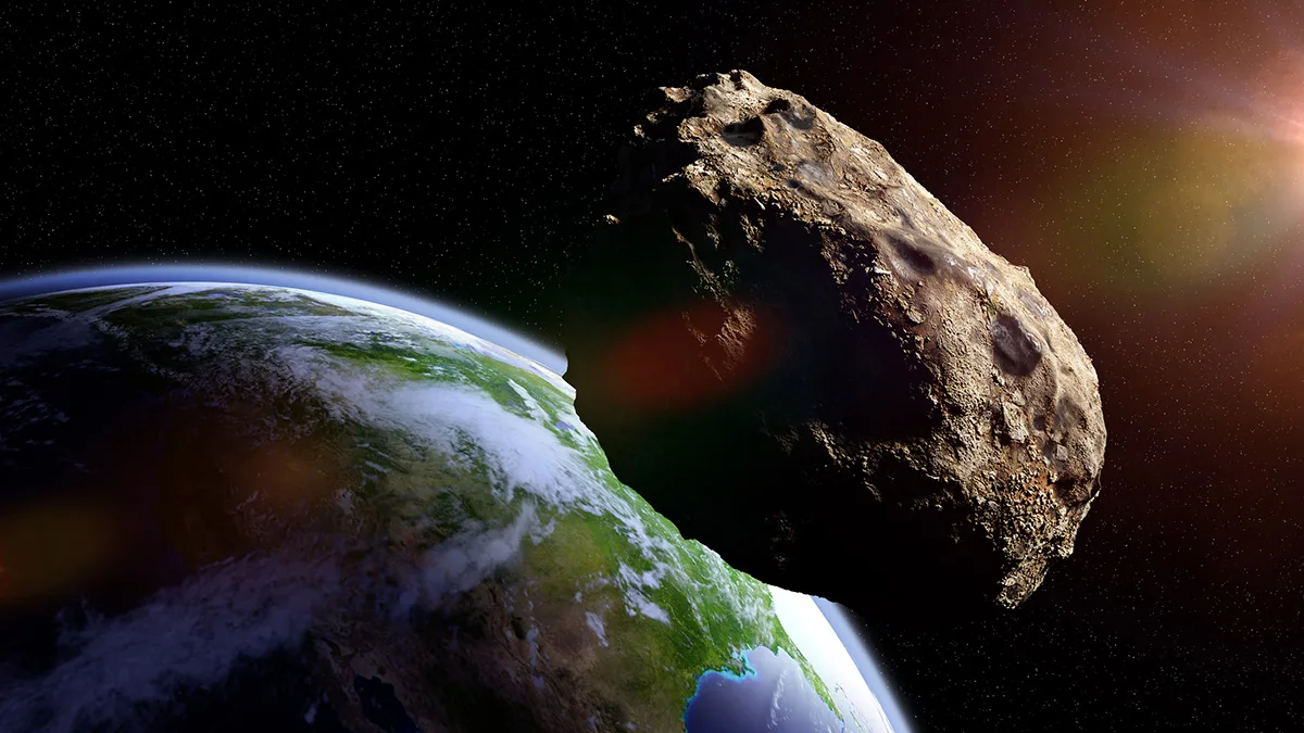Asteroid passing by close to Earth. Credit: Dotted Hippo / Getty Images