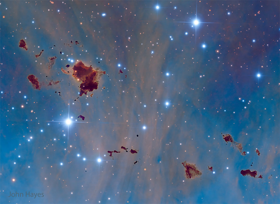 APOD: 2026 May 25 – Thackerays Globules A starfield with a blue background shows several
unusual brown globs. They are generally irregularly
shaped.
Please see the explanation for more detailed information.