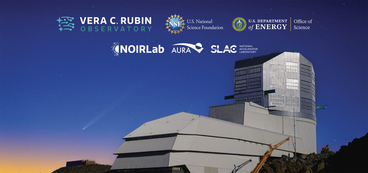 NSF-DOE Vera C. Rubin Observatory Construction A large telescope building against a dark blue sky with a comet streaking through it.