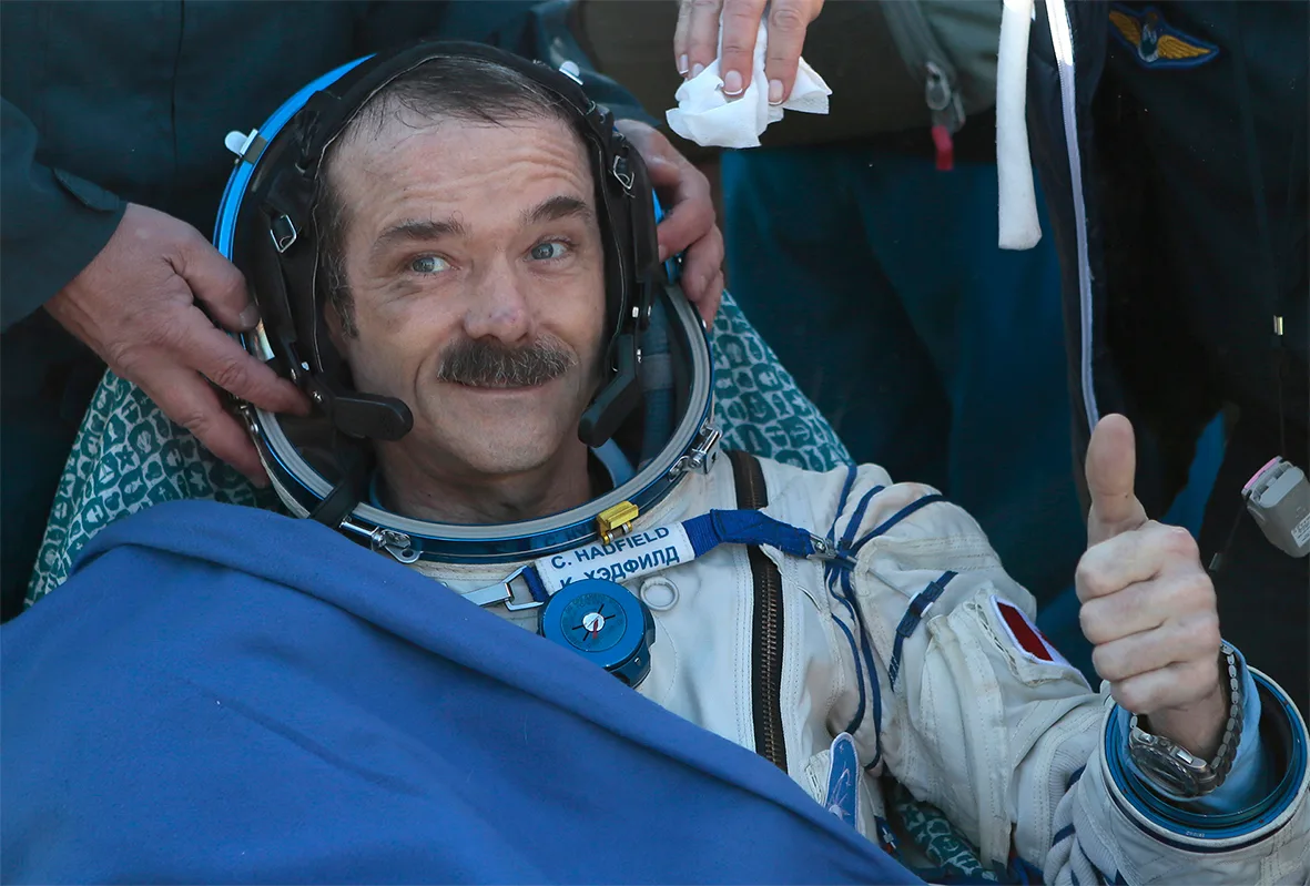 Chris Hadfield gives a thumb up shortly after arriving back on Earth from the International Space Station 