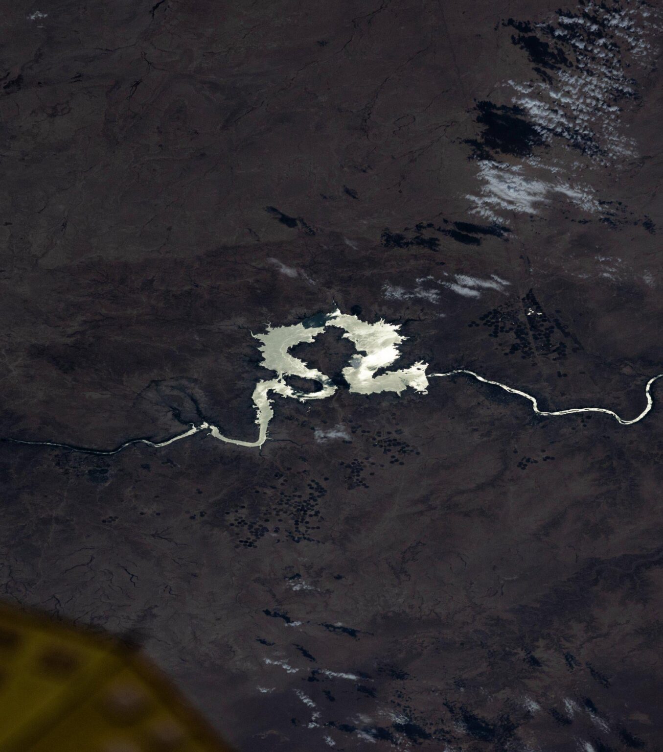 Sun glint off the Euphrates river centered on Ash Shamah, Iraq where specular reflections off the water give it a polished silver sheen. By Don Pettit