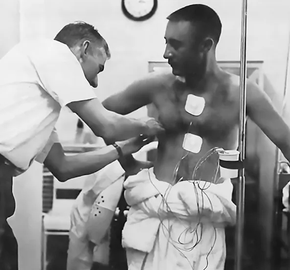 Astronaut Virgil Grissom being fitted with electrodes that would gather data on heart rate, breath cycles, and more during his spaceflight