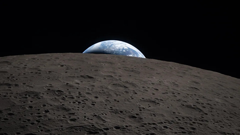 A view of the blue and white Earth setting behind the curved, gray horizon of the moon. 