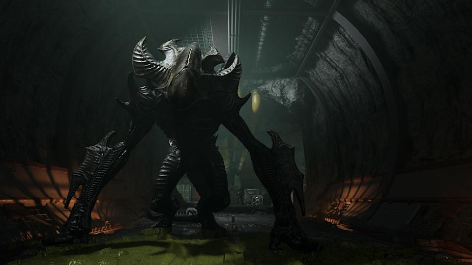 A massive, dark alien creature with four legs and menacing horns stands in a dimly lit tunnel. Its presence is ominous and imposing.