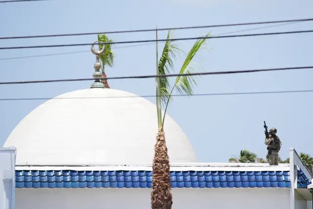 Police on a roof at the scene of the shooting in San Diego