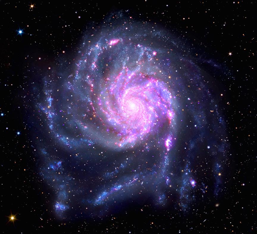This striking new view of the Pinwheel Galaxy combines X-ray light from Chandra with other types of light from ground-based observations, Hubble, & XMM-Newton. The galaxy is roughly 170,000 ly across, making it about 70% larger than our own Milky Way Galaxy.