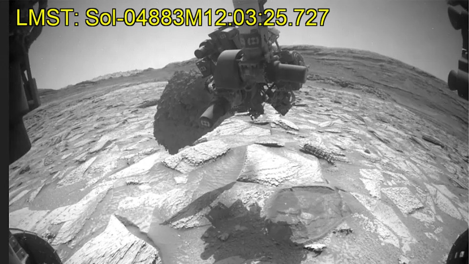 Curiosity shook and rotated the rock around in the air for days before finally shaking it off. 