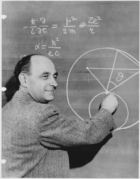 Physicist Enrico Fermi stands at a blackboard circa 1950, the same year he developed the Fermi Paradox.