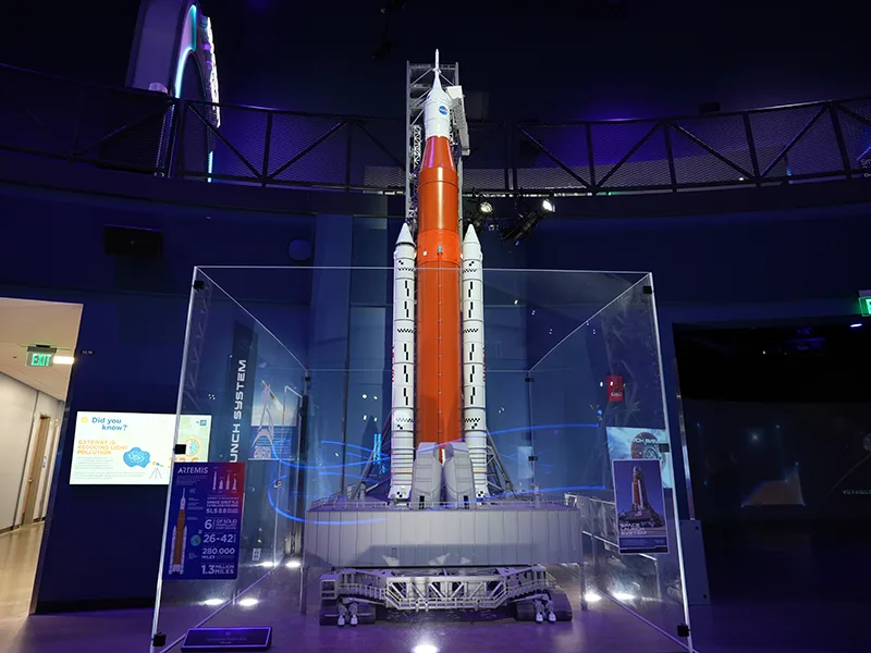 A scale model of the Space Launch System used in NASA's Artemis program to launch Orion and its payloads.