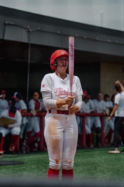Palomar Softball player #15 Alexis Huey staring at her bat before getting ready to swing against Ventura on May 2nd.