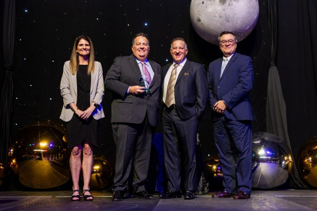 Winners Eric Unger, Vision Mechanical vice president (middle left) and Barry Unger, president, (middle right) celebrate their company with GRCA COO Sally Stewart and Jeff Rush, Chairman of the Board at the 2026 GRCA Business Excellence Awards. (Courtesy of Wayne Becker, Zerbe Studio of Photography)